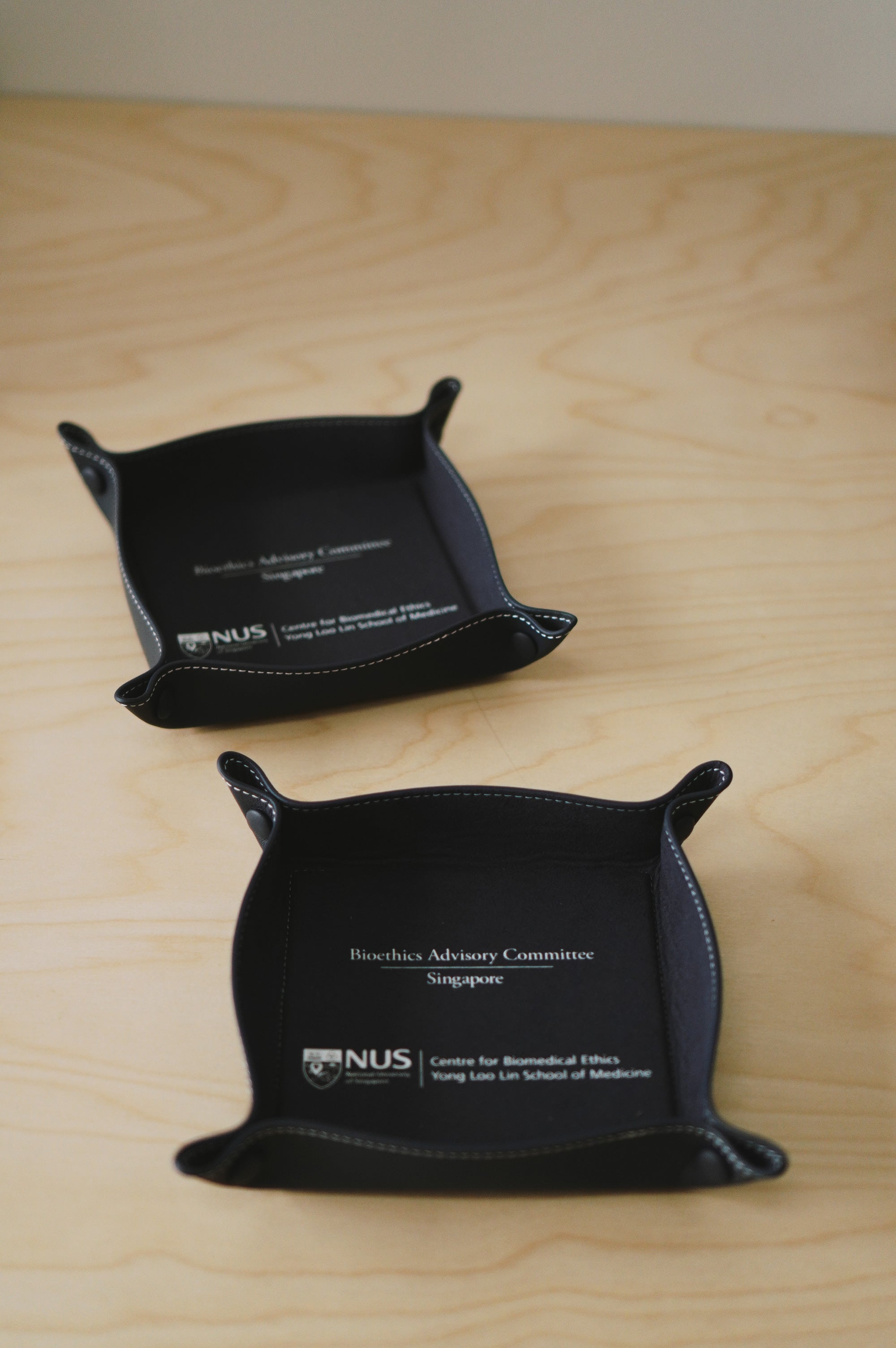 Premium leather valet trays created as corporate gifts for NUS and BAC Singapore conference