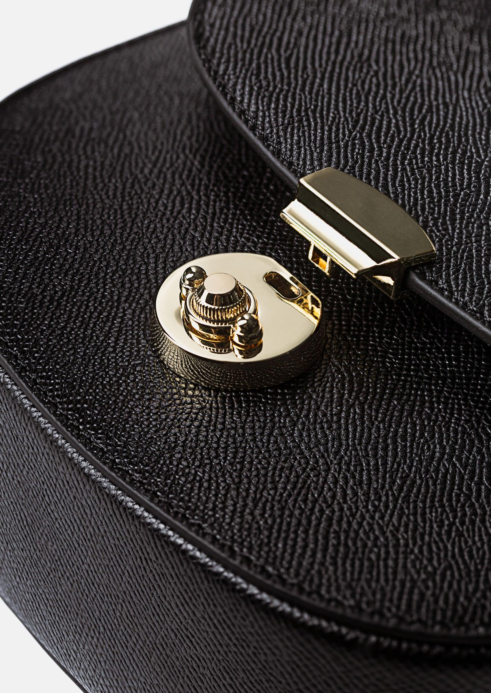Close-up of the Huns Saddle Bag showcasing its custom lock detail.