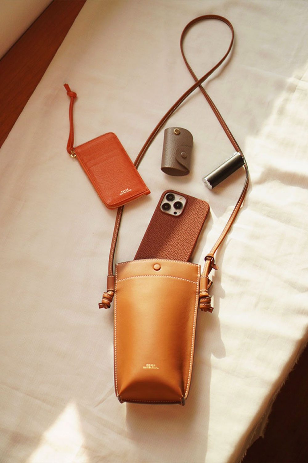 Rubin Phone Sling Bag, customised crossbody bag, showing interior capacity with phone, cards, and essentials.