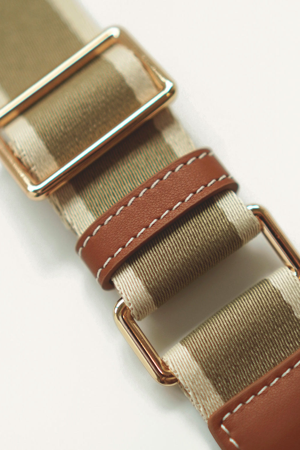 Close-up of adjustable bag strap for Daley Mini Tote Bag, showing leather details, stitching, and hardware.