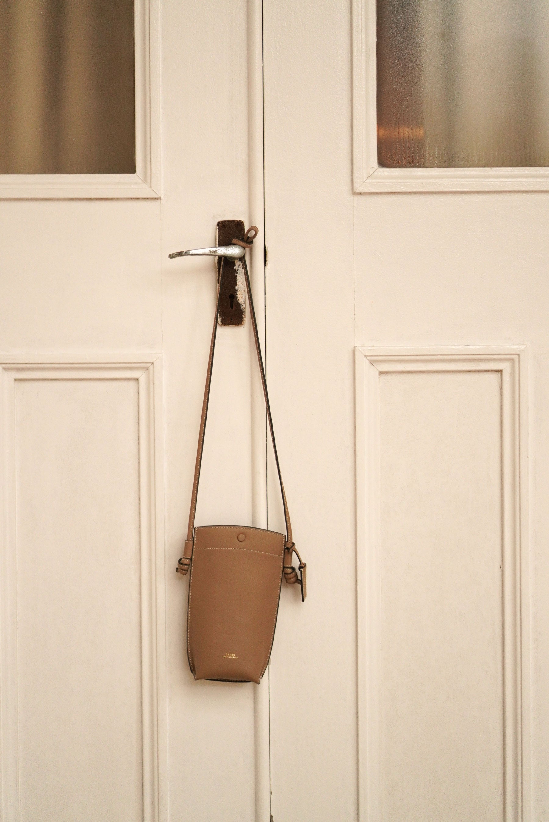 Rubin Phone Sling Bag in Biscuit, leather crossbody bag in Singapore, perfect for carrying phone, cards, and small essentials.