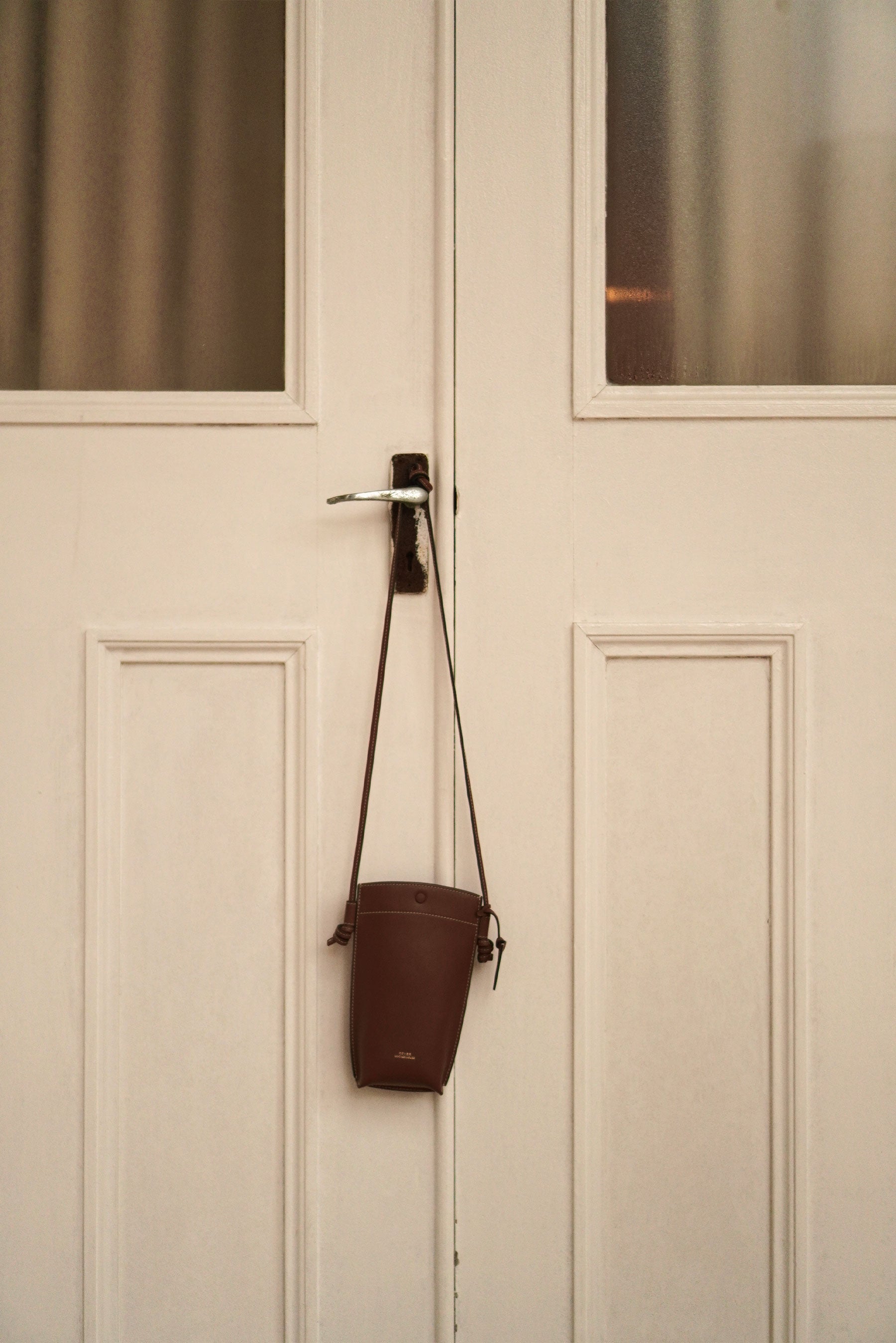 Rubin Phone Pouch Bag in Coffee, customised leather crossbody bag in Singapore, ideal for carrying phone, cards, and small essentials.