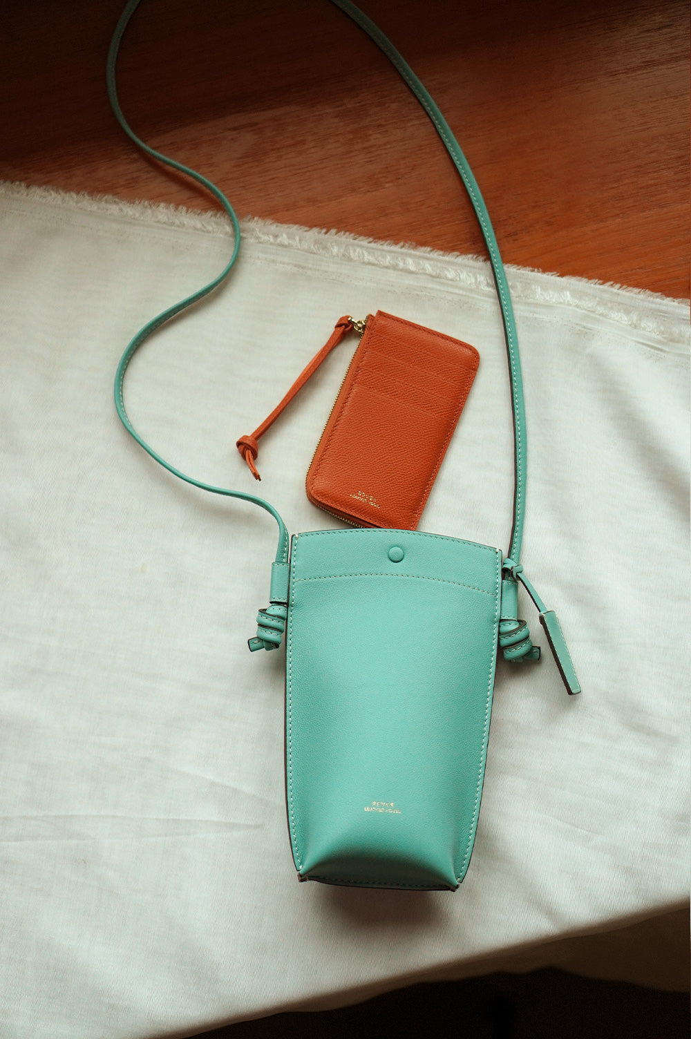Rubin Phone Bag in Mint & Eloise Zip Wallet in Orange Customised Gifts Singapore