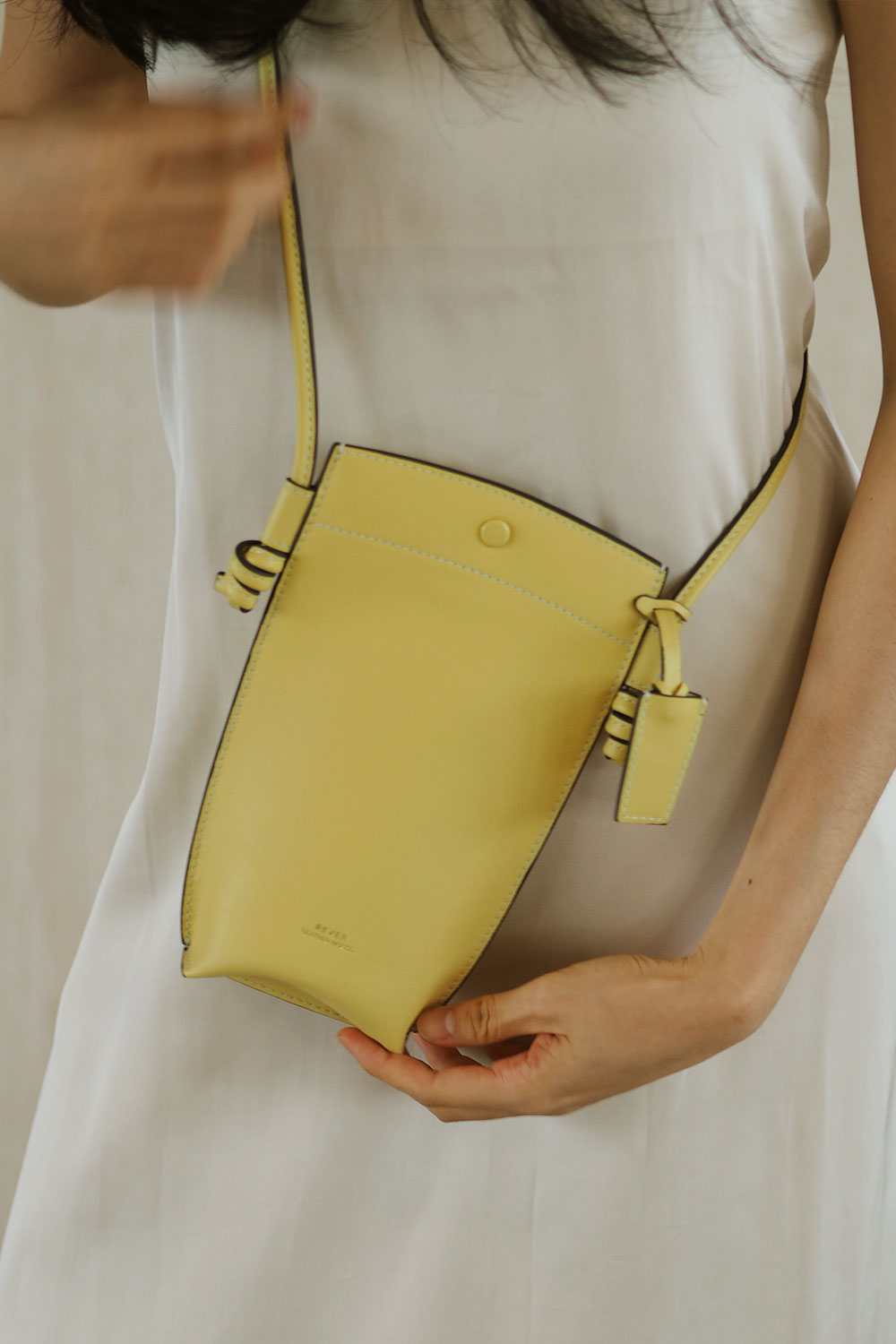 Rubin Crossbody Phone Bag in Lemon, mini leather bag in Singapore, designed for carrying phone, cards, and small essentials.