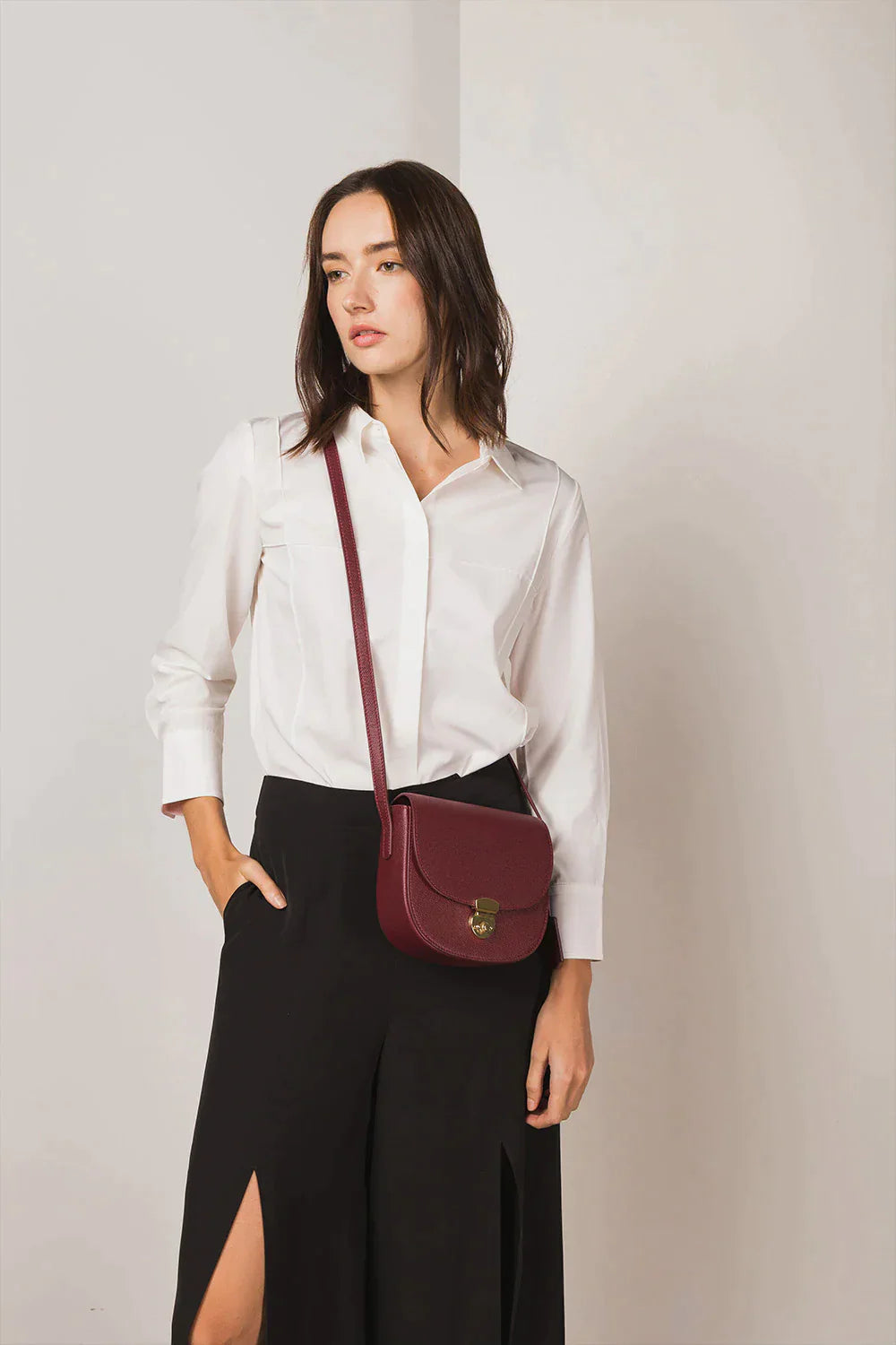 Huns Saddle Bag in Bordeaux sling on model