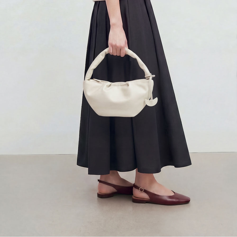Gyoza Shoulder Bag in Milk with model
