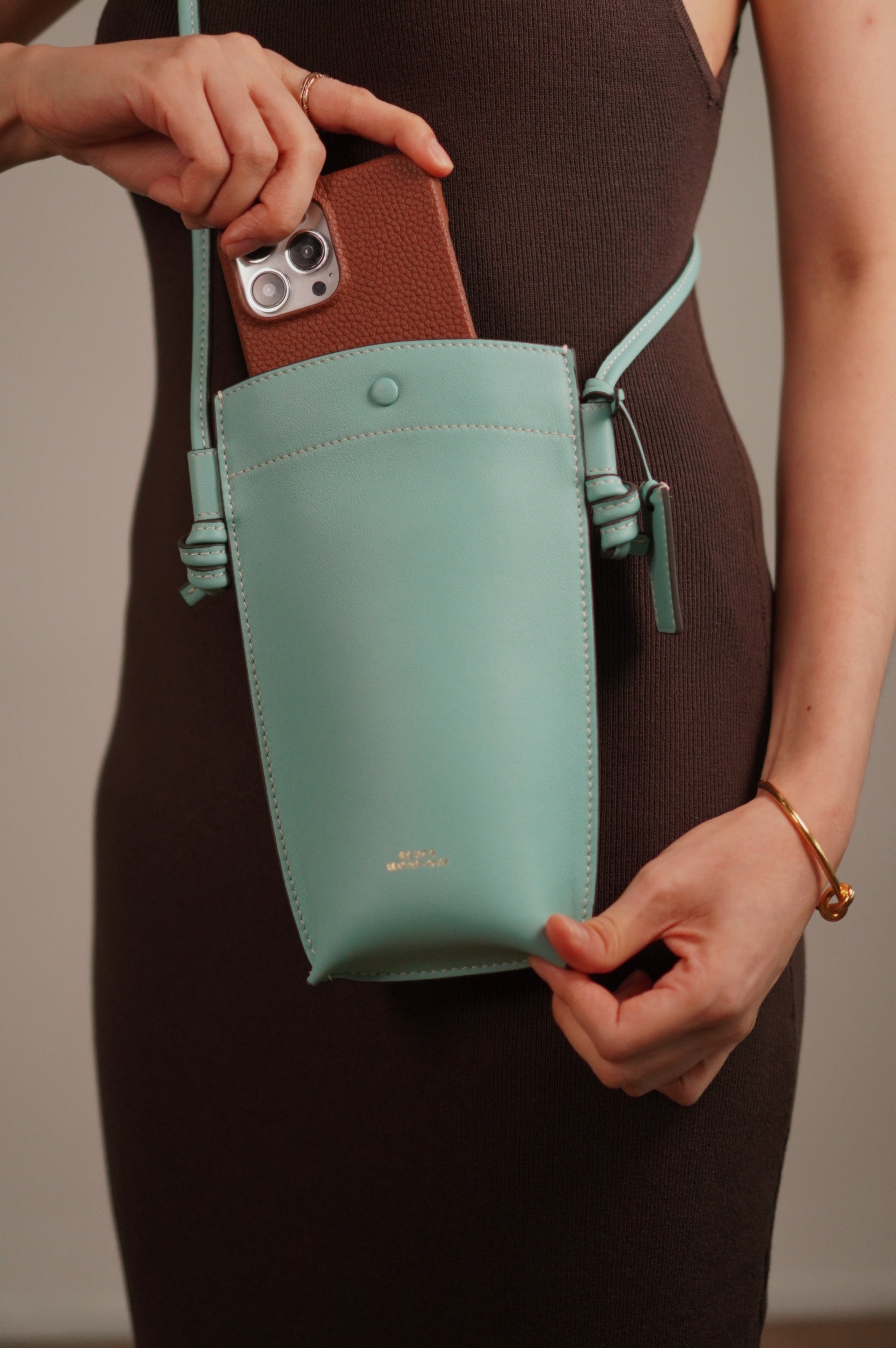 Rubin Phone Bag in Mint sling on model